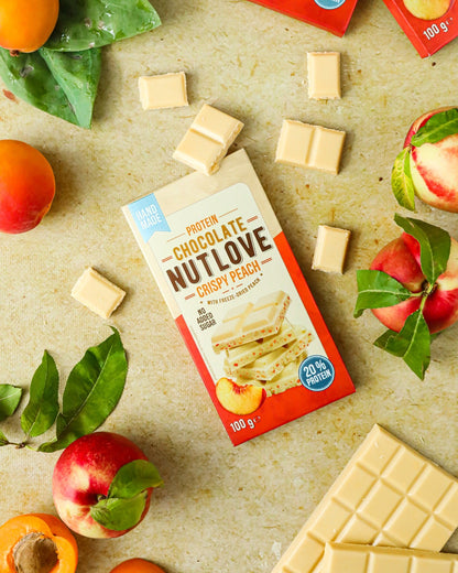 NUTLOVE baltyminis šokoladas su liofilizuotais persikais